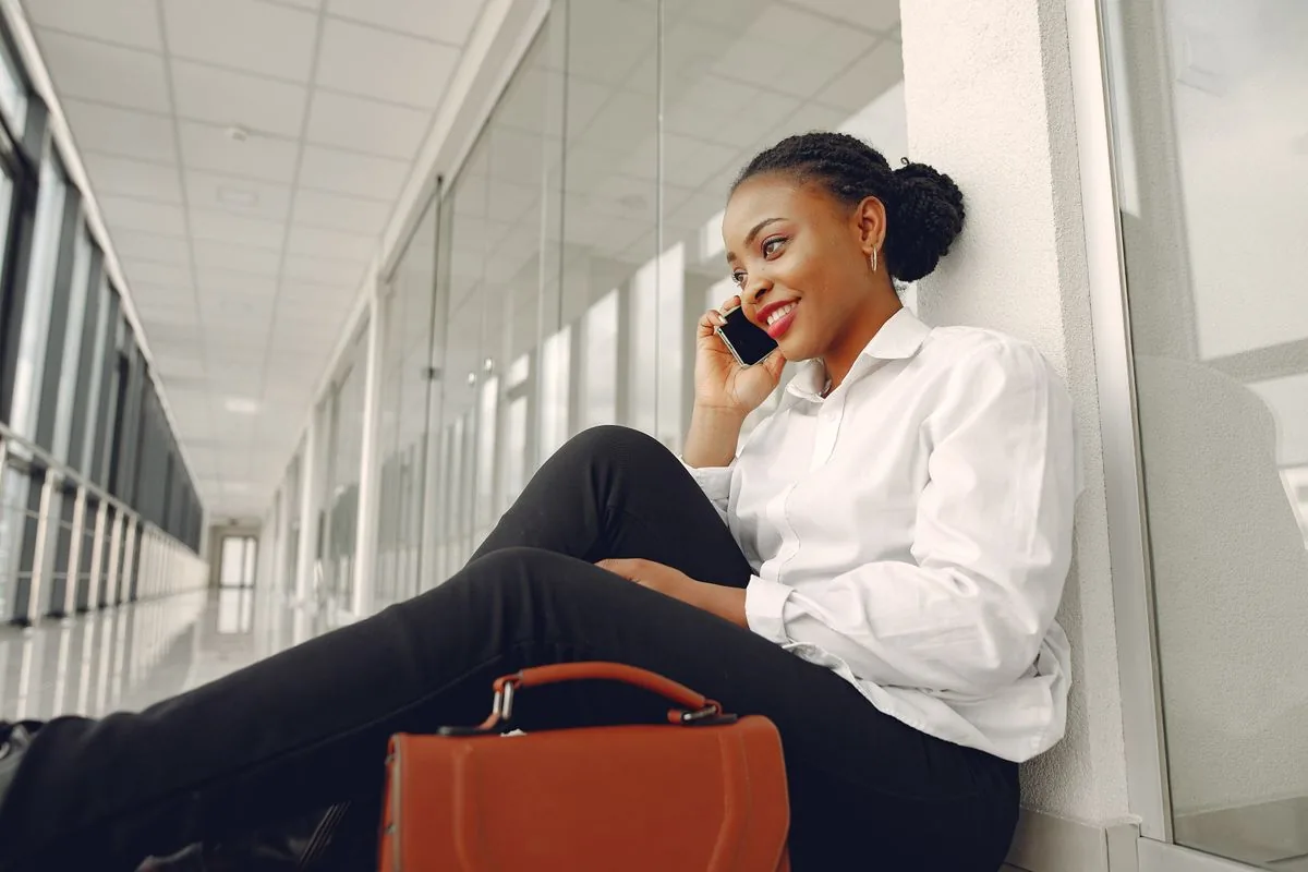 An African professional taking a call on her mobile phone